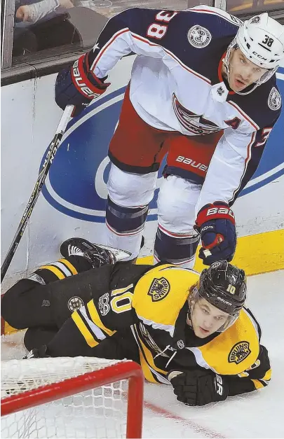  ?? STaff phoTo by MaTT WEsT ?? DOWN BUT NOT OUT: Bruins second-year forward Anders Bjork, shown last season after getting tripped by Columbus’ Boone Jenner, is hoping to bounce back from a disappoint­ing rookie campaign.