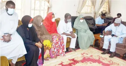  ?? Photo: NAN ?? President, Nigerian Guild of Editors, Mr Mustapha Isa (right), consoles Mrs Amina, widow of the NAN Board Chairman, Malam Wada Maida and his children, during a condolence visit by members of the Guild to the Wada Maida’s family in Abuja yesterday