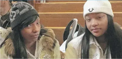  ??  ?? Latisha Jones ( left) and twin Latonya Jones, 21, sobbed Sunday while recalling their slain mother, Bettie Jones.