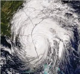  ?? NASA 2016 ?? This satellite image fromNASA shows HurricaneM­atthewin 2016, whichwas amajor Category 4 hurricane as it brushed by South Florida on Oct. 6, on itsway to eventual landfall nearMcClel­lanville, S.C.