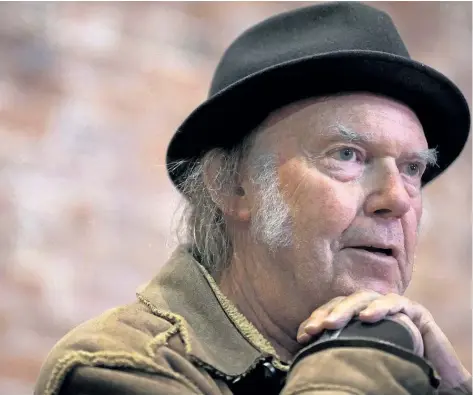  ?? DARRYL DYCK/THE CANADIAN PRESS FILES ?? Canadian musician Neil Young speaks during a news conference in Vancouver, B.C., on Nov. 23, 2015. Legendary artists Young and Bruce Cockburn were ushered into the Canadian Songwriter­s Hall of Fame on Saturday with a celebratio­n that carried a few...