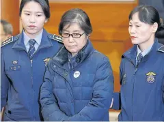  ?? AFP ?? Choi Soon-sil arrives for hearing arguments for South Korean President Park Geun-hye’s impeachmen­t trial at the Constituti­onal Court in Seoul on Jan 16.