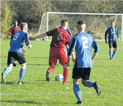  ??  ?? Bedians on their excellent playing surface taking on Mellor’s seconds (in blue)