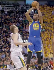  ?? — AP ?? Golden State Warriors’ Kevin Durant (right) prepares to shoot in their NBA second-round playoff on Saturday.