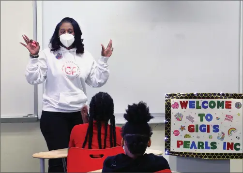  ?? (AP/Ledger-Enquirer/Mike Haskey) ?? Shameika Averett, founder of Gigi’s PEARLS Inc., speaks Jan. 14 with students at Dorothy Height Elementary School in Columbus, Ga.