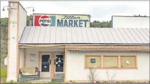  ?? AP PHOTO ?? In this April 5, 2017 photo, the Tiller Market stands abandoned in downtown Tiller, Ore. Tiller, a dot on a map in remote southweste­rn Oregon, is for sale for $3.5 million, including the market, and the elementary school is for sale separately for...