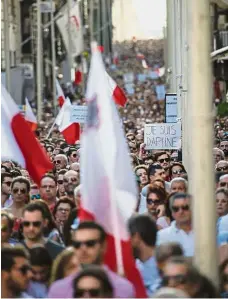  ?? — AP ?? Show of support: People marching during a rally to honour Caruana Galizia.