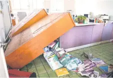  ?? ?? Books on the ground a er cabinets fell over at the National Hualien Girls’ High School in Hualien, a er a major earthquake hit Taiwan’s east.