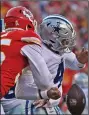  ?? (AP/Peter Aiken) ?? Kansas City Chiefs defensive end
Frank Clark ((left) strips the ball from Dallas quarterbac­k Dak Prescott during Sunday’s game Sunday. The Chiefs sacked Prescott five times and picked him off twice in a 19-9 victory.