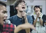  ?? Marcus Yam Los Angeles Times ?? BEN CHAN, center, sings with other members of Boyz Reborn during a rehearsal in Hong Kong last month. Chan was arrested during the protests.