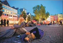  ?? Sascha Steinbach EPA/Shuttersto­ck ?? STUDENTS gather for a climate change rally in Cologne, Germany. Cal State University is among the institutio­ns to join a pact to confront global warming.