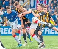  ??  ?? Filip Helander in the thick of it against East Fife