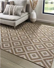  ?? ?? Eco Living rugs and runners made from recycled T-shirts include this large Aztec rug in tuscan sun, 160cm x 230cm, £89.99 (flooringsu­perstore.com)