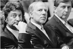  ?? ED KAISER/ EDMONTON JOURNAL ?? Daryl Katz, left, and his team wait to hold a public discussion before city council on the arena project in July 2010.