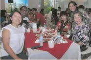  ??  ?? FELLOWSHIP. At the Mandani Bay Mooncake Festival: marketing manager Leorelei Ylaya, CVU, Flor Ynclino and (standing) Jingjing Mariño-Farrarons.