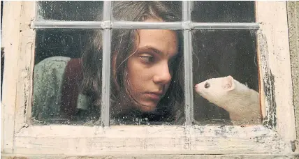  ?? HBO ?? Lyra Belacqua (portrayed by Dafne Keen) shares a moment with her daemon, Pan (Kit Connor), in HBO’s “His Dark Materials.”