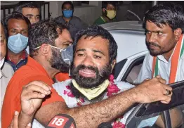  ?? — PTI ?? Dr Kafeel Khan ( centre) following his release from Mathura jail around midnight on Tuesday, after the Allahabad high court quashed his detention under the National Security Act and ordered his immediate release earlier in the day.