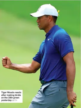  ?? GETTY ?? Tiger Woods reacts after making birdie on the 18th green yesterday