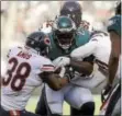  ?? RICK KAUFFMAN — DIGITAL FIRST MEDIA ?? Eagles running back LeGarrette Blount, here carrying a group of Bears defenders, ran for 97 yards on 15 carries in Sunday’s 31-3 win over Chicago. The balance Blount provides on offense is one of many reasons why the 2017 Eagles warrant comparison­s to...