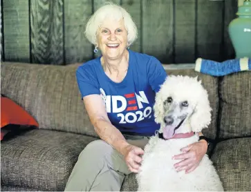  ?? [COURTNEY HERGESHEIM­ER/DISPATCH] ?? Mary Lightbody, a first-time delegate, will watch the Democratic National Convention from her home in Westervill­e with her dog, River. The convention is being held virtually this year because of the COVID-19 pandemic.