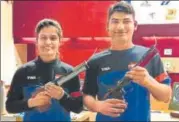  ?? HT ?? ▪ Manu Bhaker and Om Prakash after the 10m mixed team success. Manu says she’ll try not to get bogged down by expectatio­ns.