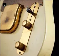  ??  ?? The bell-shaped pickup cover, so often removed on vintage Fenders, has a characteri­stic dimple on the underside left by the electropla­ting process