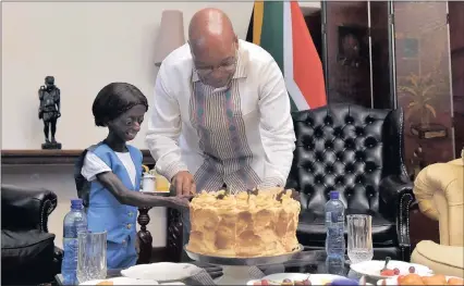  ??  ?? HONOURED GUEST: Ontlametse Phalatse shares a slice of birthday cake with President Jacob Zuma in Pretoria.