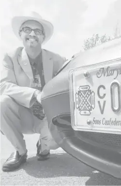  ?? H. DARR BEISER, USA TODAY ?? Jay Barringer, commander of theMarylan­d Division of Sons of Confederat­e Veterans, has license plates that feature the Confederat­e flag.