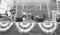  ?? DANIEL BOCK Miami Herald file ?? A band performs during the 2012 July 4 celebratio­n at the Homestead-Miami Speedway.