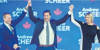  ?? ANDREW VAUGHAN, CP ?? Former Progressiv­e Conservati­ve leader Peter MacKay introduces Conservati­ve Leader Andrew Scheer and Scheer’s wife, Jill, Friday at the party’s national policy convention in Halifax.