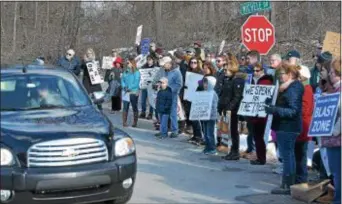  ?? PETE BANNAN – DIGITAL FIRST MEDIA ?? Local residents protest against the Mariner East 2 pipeline project at Michele Drive and Ship Road in West Whiteland recently. The neighborho­od has been the site of sinkhole problems believed linked to pipeline constructi­on.