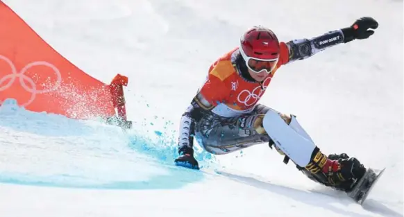  ?? LAURENT SALINO/GETTY IMAGES ?? Czech Olympian Ester Ledecka was a double threat, borrowing a pair of skis to win the super-G and then picking up another gold in parallel slalom snowboardi­ng.