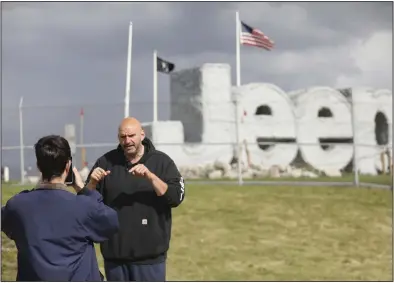  ?? (AP/The Blade/Kurt Steiss) ?? U.S. Sen. John Fetterman (right), D-Pa., has a video filmed at the United Auto Workers picket line at the Stellantis Toledo Assembly Complex on Friday in Toledo, Ohio.