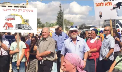  ?? (Tovah Lazaroff) ?? PROTESTERS RALLY in Jerusalem yesterday against the demolition of homes in unauthoriz­ed West Bank outposts.