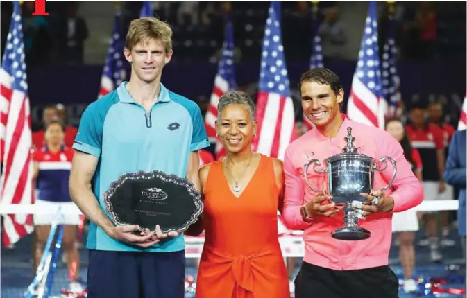  ??  ?? NEW YORK: Kevin Anderson of South Africa and Rafael Nadal of Spain pose with USTA President Katrina Adams during the trophy ceremony after their Men’s Singles Finals match on Day Fourteen of the 2017 US Open at the USTA Billie Jean King National Tennis...