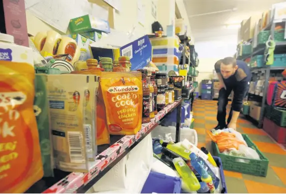  ??  ?? > A Trussell Trust foodbank – last year alone, 95,190 food parcels were given out in Wales compared to 14,696 in 2012