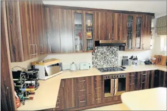  ??  ?? MODERN LIVING: The spacious kitchen has a separate laundry area