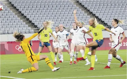  ?? (Photo: AFP) ?? Sweden’s forward Stina Blacksteni­us (second right) shoots to score her team’s second goal during the Tokyo 2020 Olympic Games women’s Group G first-round football match versus United States at the Tokyo Stadium in Japan yesterday.