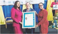  ??  ?? Director of Informatio­n and Communicat­ion Technology Unit, Government of Dominica, Jermaine Jewel JeanPierre (left), displays the citation she received from the Management Institute for National Developmen­t (MIND) at the institutio­n’s annual conference...