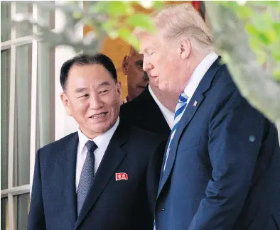  ?? ANDREW HARNIK / THE ASSOCIATED PRESS ?? President Donald Trump talks with Kim Yong Chol, former North Korean military intelligen­ce chief and one of leader Kim Jong Un’s closest aides, as they walk from their meeting in the Oval Office of the White House on Friday.