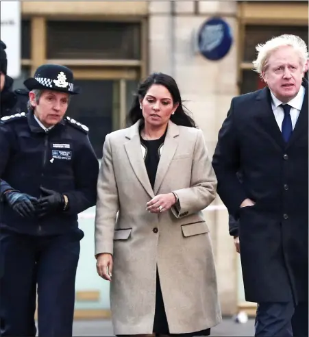  ?? ?? TERROR SCENE: Priti Patel and Boris Johnson with Met Police Commission­er Cressida Dick, left, and City of London Police Commission­er Ian Dyson, right, on London Bridge yesterday