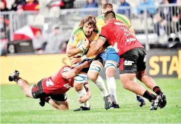  ?? — AFP photo ?? Northern Bulls' Lood de Jager is tackled against Canterbury Crusaders during the 2018 Super Rugby season.The South African is expecting brutal clashes because of the World Cup later this year.