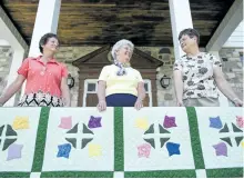  ?? JESSICA NYZNIK/EXAMINER ?? Darlene Sullivan, left, Mary McKeiver, and Barbara Meade display the Tulips for Douro quilt at St. Joseph’s Parish Hall in Douro on Tuesday. Douro Doings is happening Monday at the Parish Hall and Douro Park.