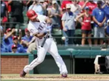  ?? TONY GUTIERREZ — THE ASSOCIATED PRESS ?? Texas Rangers’ Adrian Beltre hits a double off a pitch from Baltimore Orioles’ Wade Miley in the fourth inning of a baseball game, Sunday in Arlington, Texas. The hit was the 3,000th of Beltre’s career.