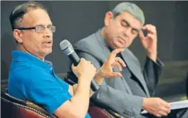  ?? AFP ?? Infosys’ chief operating officer UB Pravin Rao (left) with CEO Vishal Sikka during the company’s fourthquar­ter results announceme­nt, in Bengaluru on Thursday