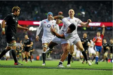  ?? GETTY IMAGES ?? Bottom left: England last beat the All Blacks on New Zealand soil in 2003, 15-13 in Wellington. Bottom right: Manu Tuilagi scores his try in England’s 38-21 win over the All Blacks in 2012.
