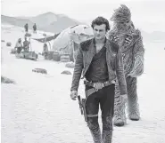  ?? FILE PHOTO BY JONATHAN OLLEY/LUCASFILM VIA AP ?? Alden Ehrenreich and Joonas Suotamo appear in a scene from “Solo: A Star Wars Story.”