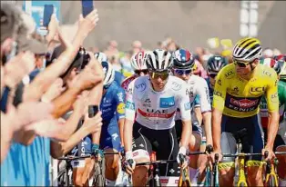  ?? Thomas Samson / Getty Images ?? Tadej Pogacar, left, and Mathieu van der Poel, in the leaders’ yellow jersey, were two of the riders to lose time Friday in the longest Tour de France stage in 21 years.