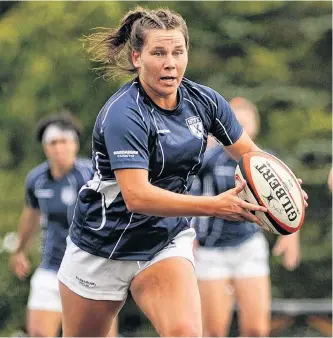  ?? BRYAN KENNEDY • ST. F.X. ATHLETICS ?? St. Francis Xavier fly-half Hannah Ellis of Halifax runs with the ball during an Atlantic university rugby exhibition match last Saturday against Acadia.