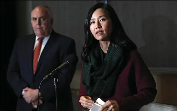  ?? NANCY LANE — BOSTON HERALD ?? Mayor Michelle Wu stands with City Council President Ed Flynn in a Dec. 22, 2022 file photo. Flynn may helm the council, but it’s the body’s left wing that will give her the greatest challenges in her second year.